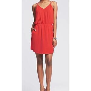 Banana Republic sleeveless dress in a vibrant orange features a high neckline